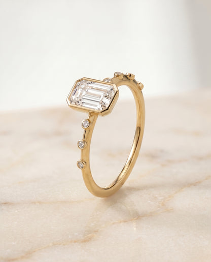 The Brandi Bezel Accent Solitaire Engagement Ring Setting for Emerald Diamonds in 18K Yellow Gold