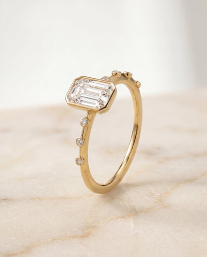 The Brandi Select Bezel Accent Solitaire Emerald Cut Engagement Ring with Lab Diamond in 14K Yellow Gold — view 6