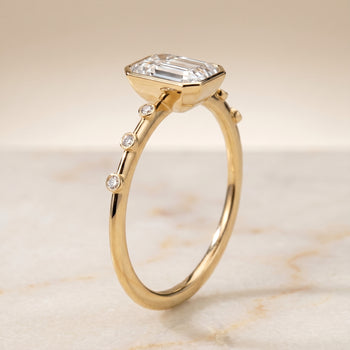 The Brandi Bezel Accent Solitaire Engagement Ring Setting for Emerald Diamonds in 18K Yellow Gold