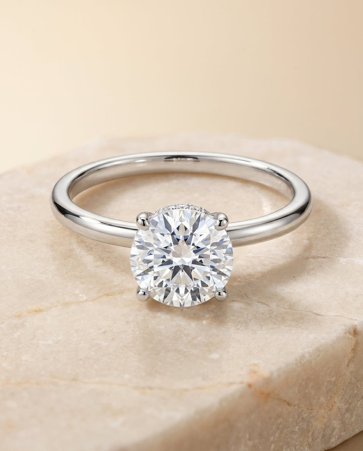 Joni Select Hidden Halo Solitaire Round Lab Diamond Engagement Ring in 18K White Gold, shown on hand, angled | RockHer