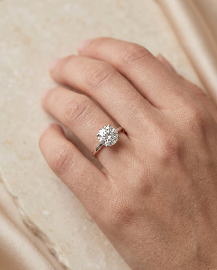 The Joni Hidden Halo Solitaire Round Engagement Ring Setting in 18K White Gold