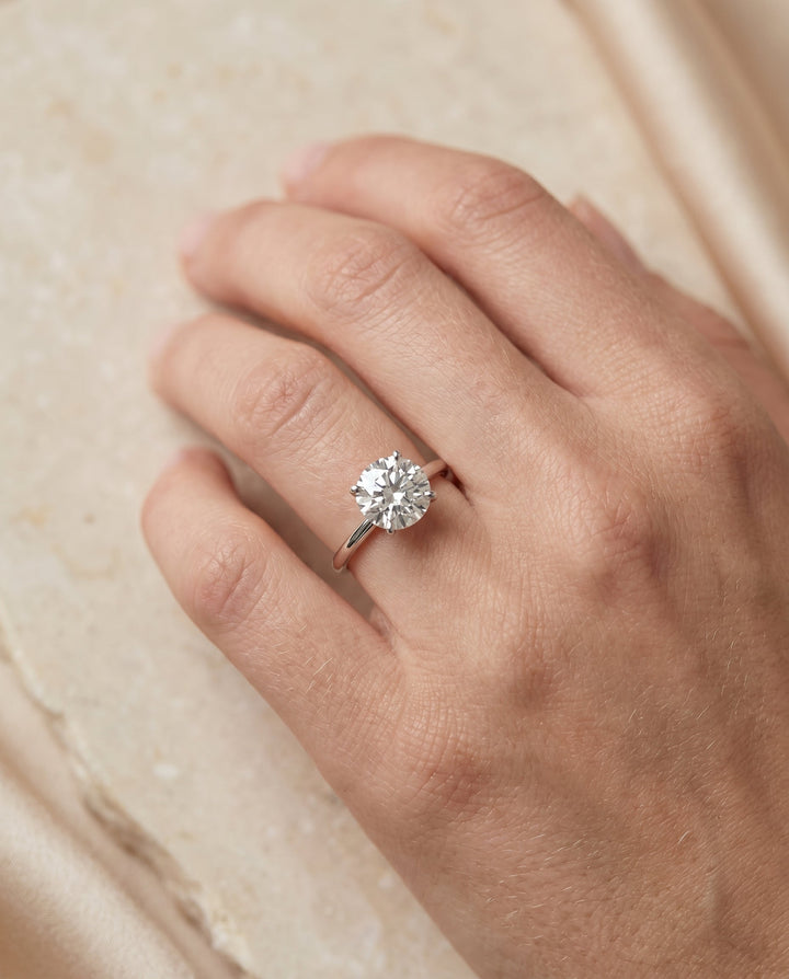 Joni Select Hidden Halo Solitaire Round Lab Diamond Engagement Ring in 18K White Gold, shown on hand | RockHer