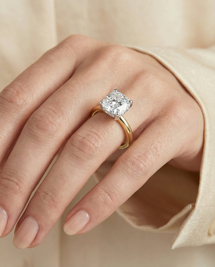 Hidden Pavé Basket Crown Solitaire Cushion, in 18K Yellow Gold – lifestyle shot | RockHer