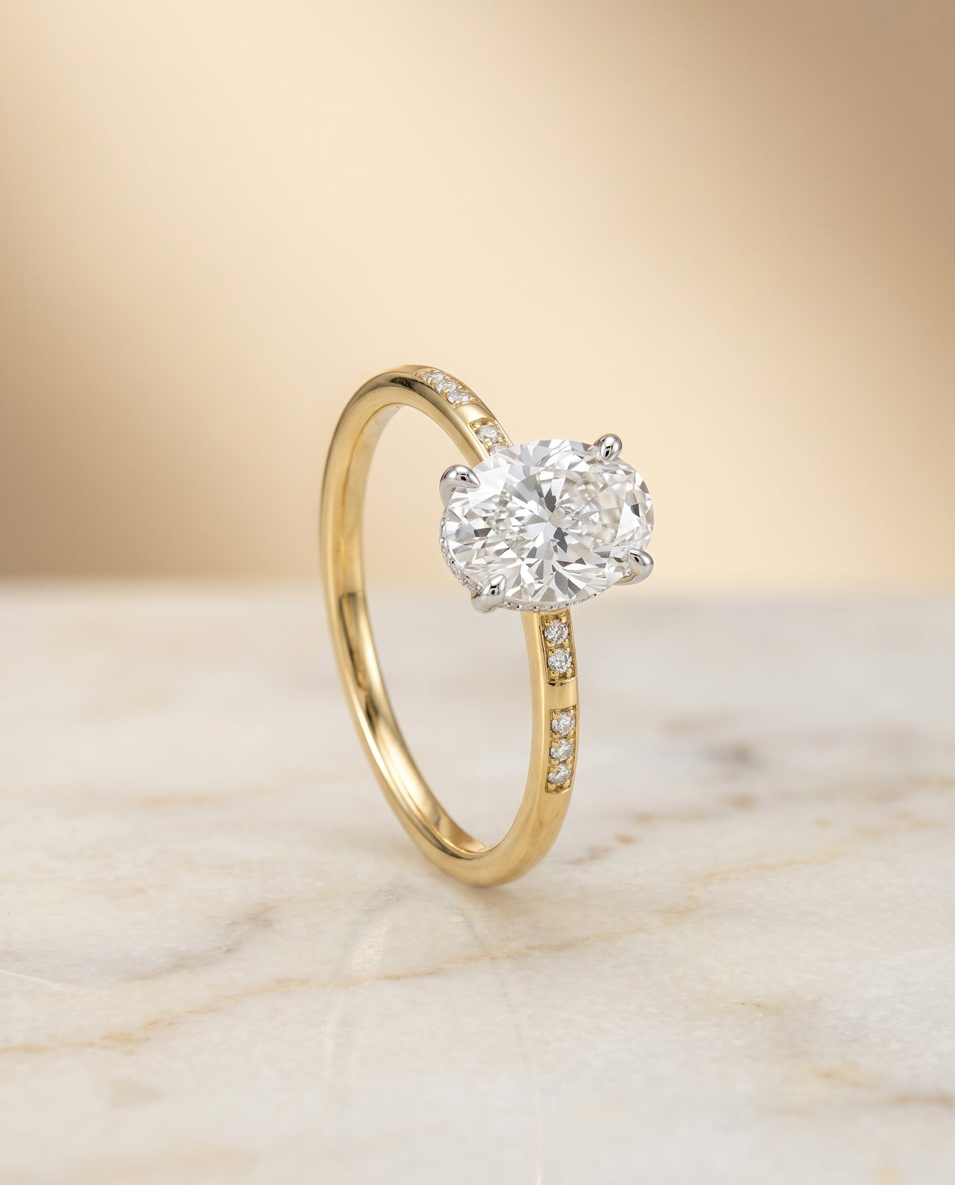 Wanda Select Hidden Halo Pavé Solitaire Oval Lab Diamond Engagement Ring in 18K Yellow Gold, front view | RockHer