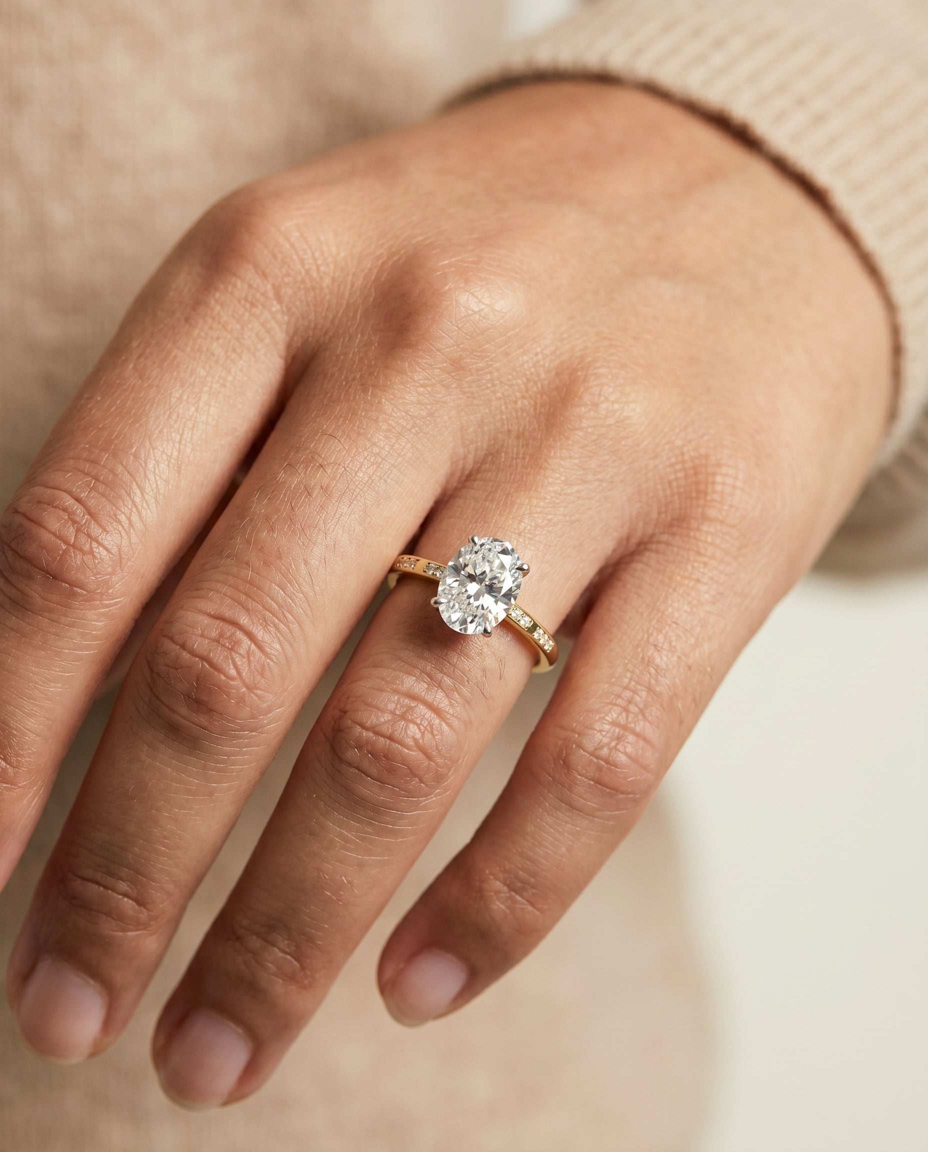 Wanda Select Hidden Halo Pavé Solitaire Oval Lab Diamond Engagement Ring in 18K Yellow Gold, shown on hand | RockHer