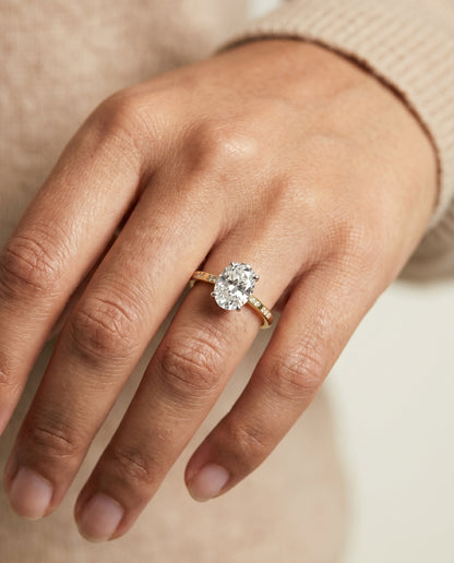 Wanda Select Hidden Halo Pavé Solitaire Oval Lab Diamond Engagement Ring in 18K Yellow Gold, shown on hand | RockHer