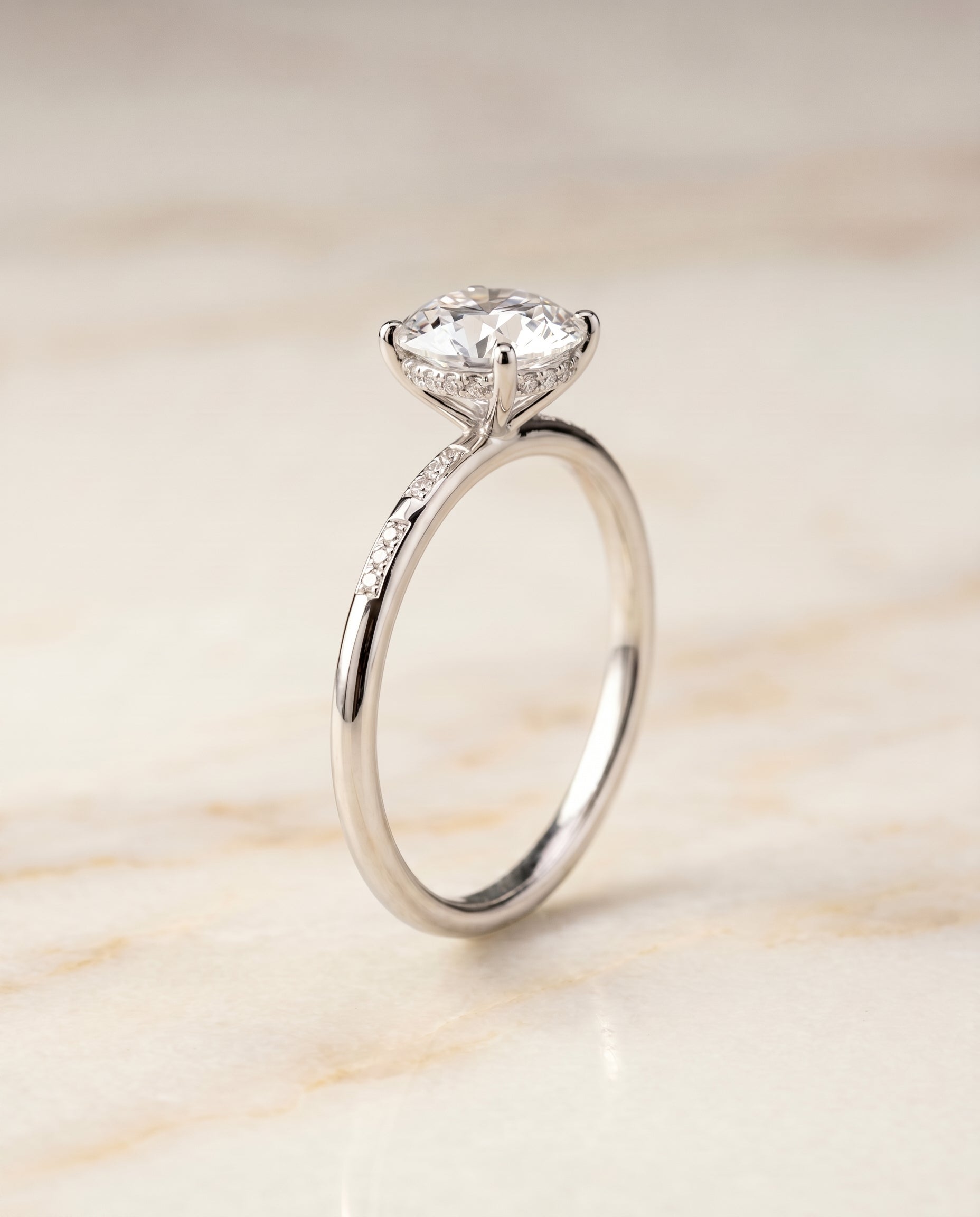 Hidden Halo Pavé Solitaire styling on The Wanda round engagement ring setting | RockHer
