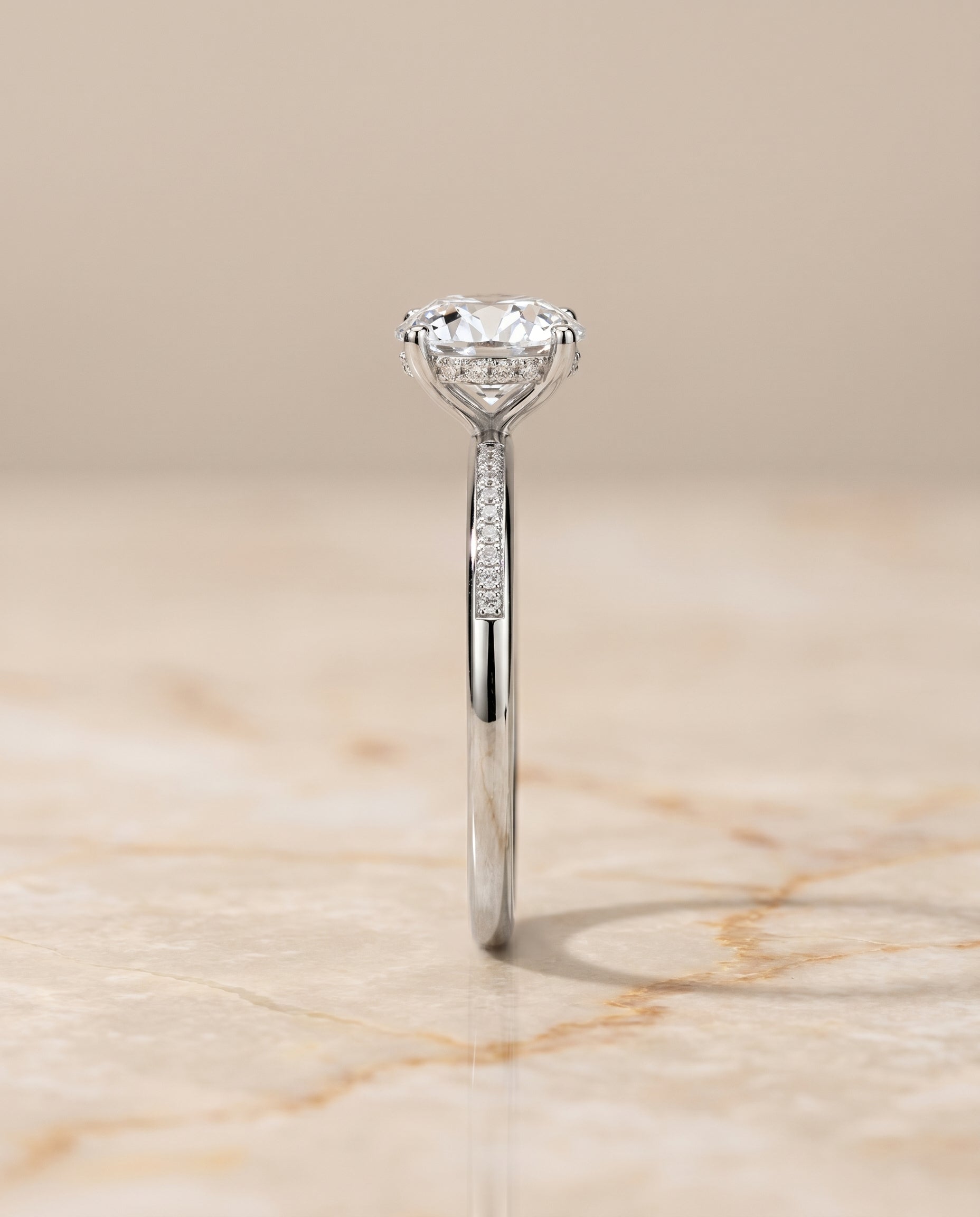 The Brenda high hidden halo solitaire engagement ring setting, shown in Platinum | RockHer