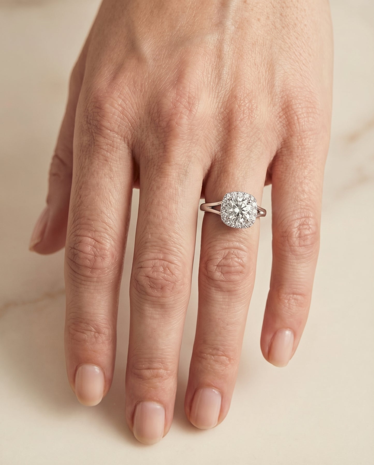 High Polish Simple Halo Cushion, in 18K White Gold, prong setting – lifestyle shot | RockHer