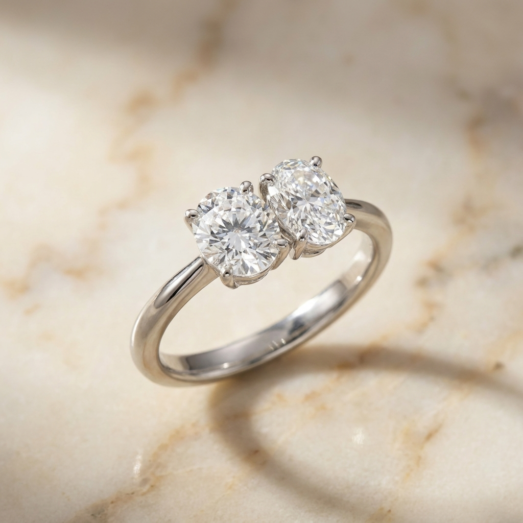 18K White Gold Jackie Select Toi et Moi Round & Oval Knife Edge Band Lab Diamond Engagement Ring - Hero on warm marble