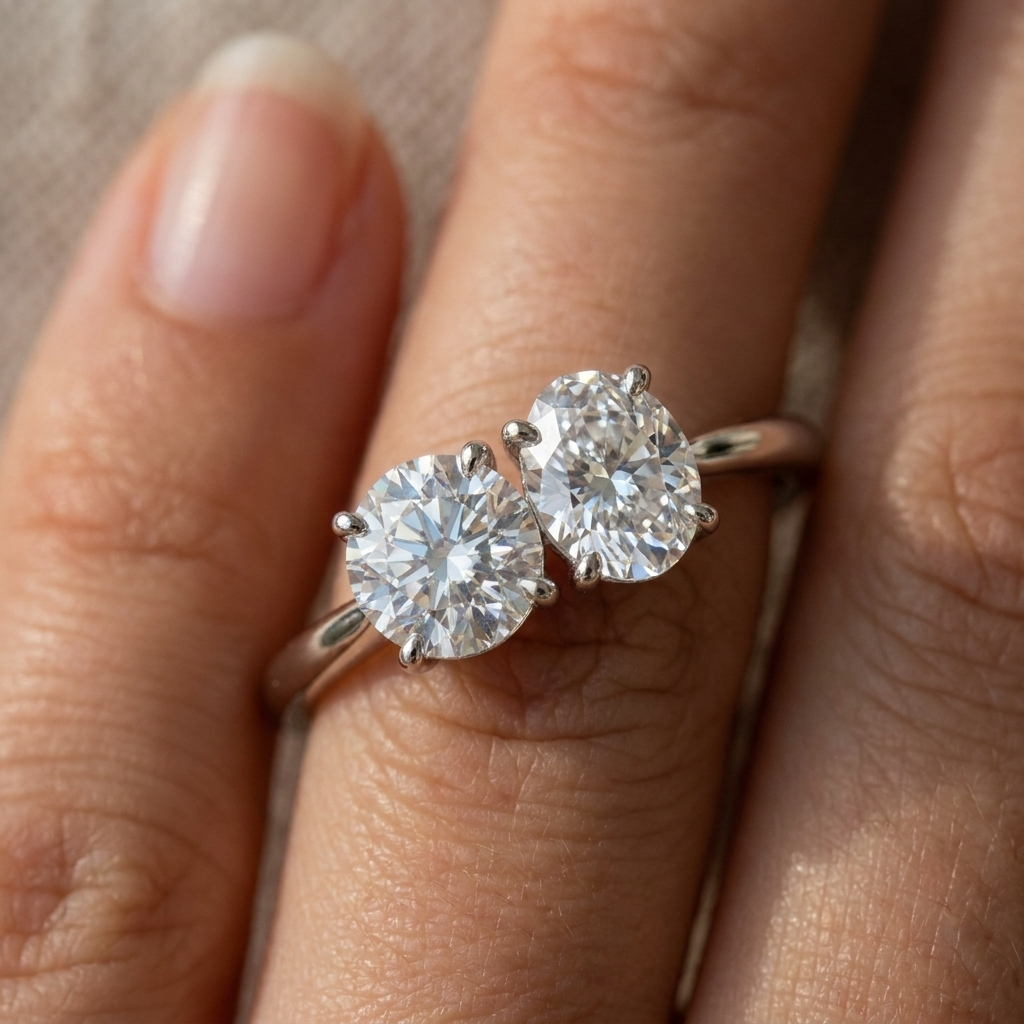 18K White Gold Jackie Select Toi et Moi Round & Oval Knife Edge Band Lab Diamond Engagement Ring - Macro close-up on finger