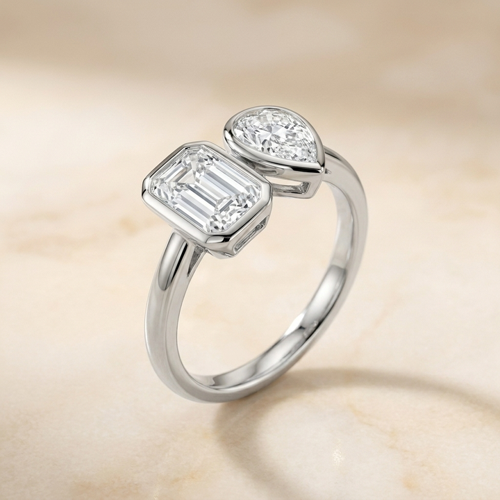 14K White Gold Josephine Select Toi et Moi Emerald & Pear Bezel Set Lab Diamond Engagement Ring - Alt angle on warm marble
