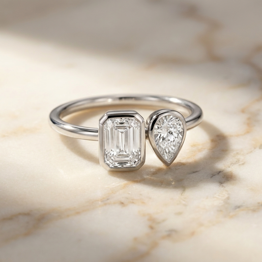14K White Gold Josephine Select Toi et Moi Emerald & Pear Bezel Set Lab Diamond Engagement Ring - Hero on warm marble