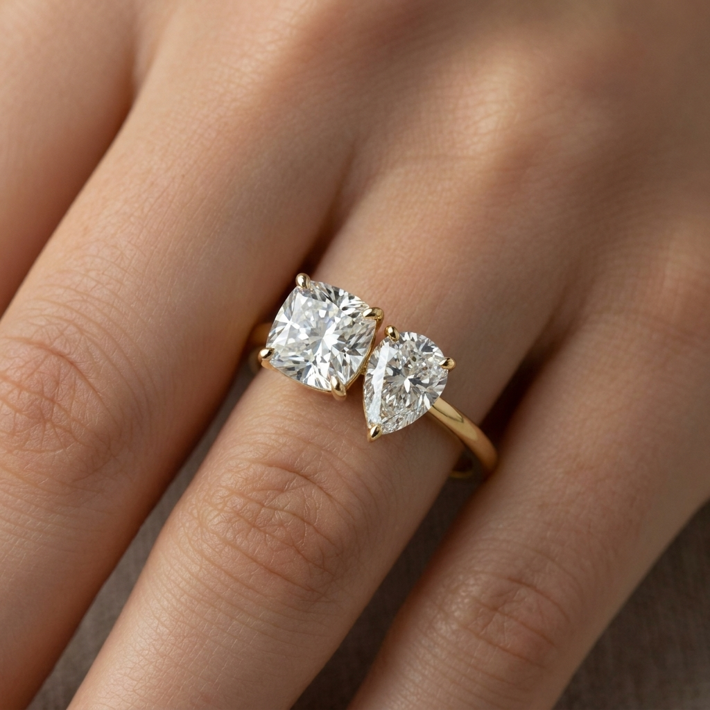 14K Yellow Gold Lauryn Toi et Moi Select Cushion & Pear Lab Diamond Engagement Ring - Macro close-up on finger