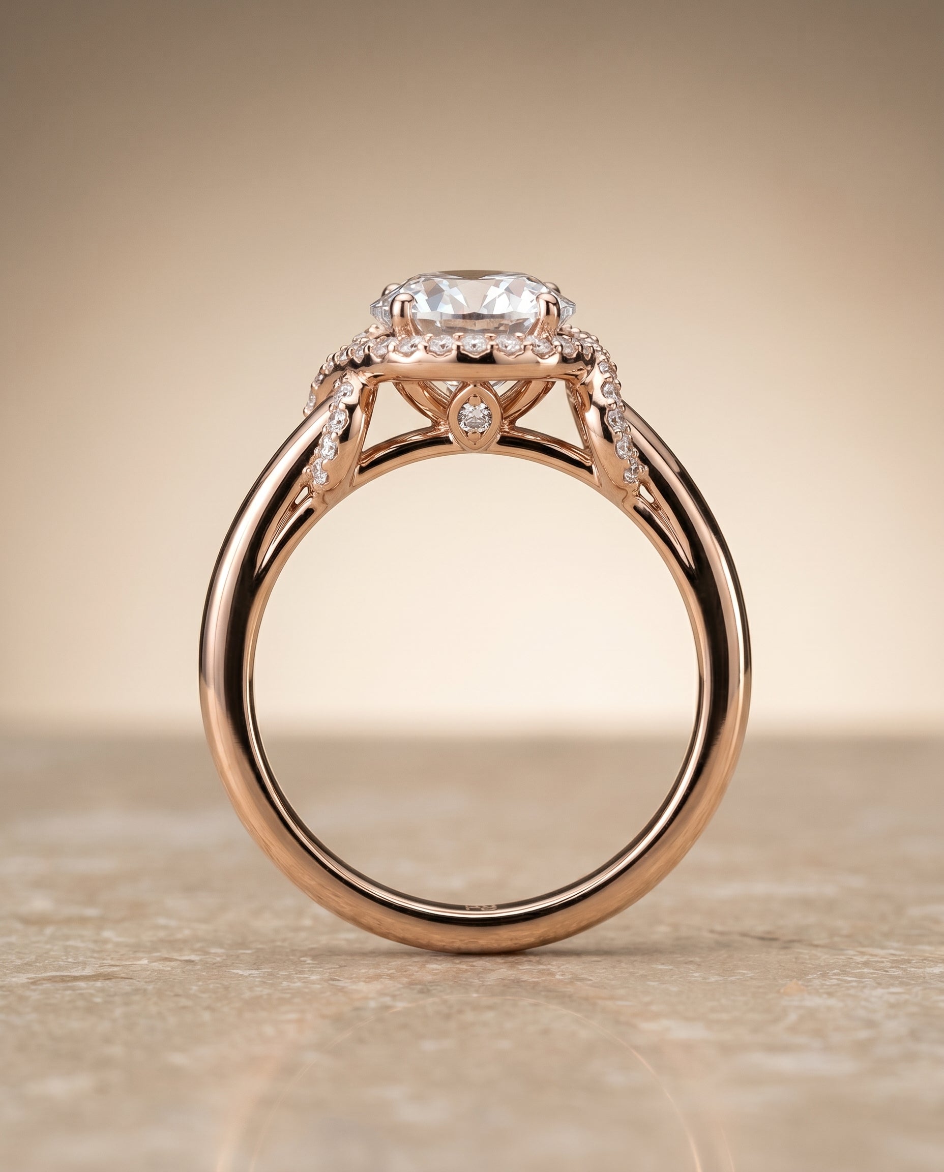 The Calista love knot halo engagement ring setting, shown in 14K Rose Gold | RockHer