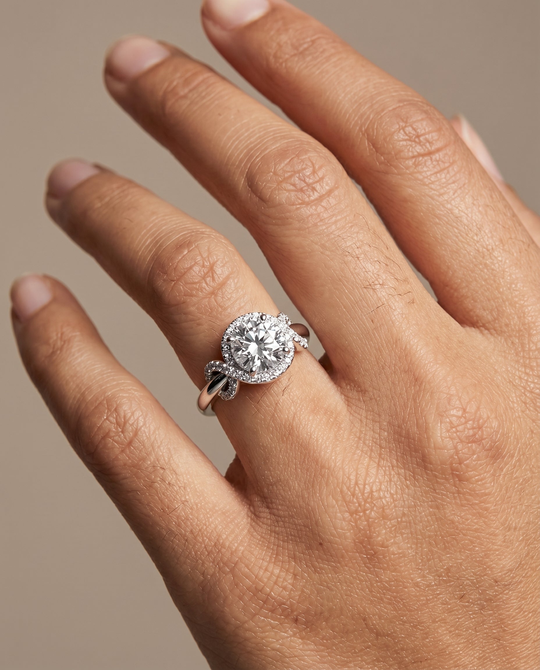 The Calista engagement ring setting in Platinum, love knot halo design | RockHer