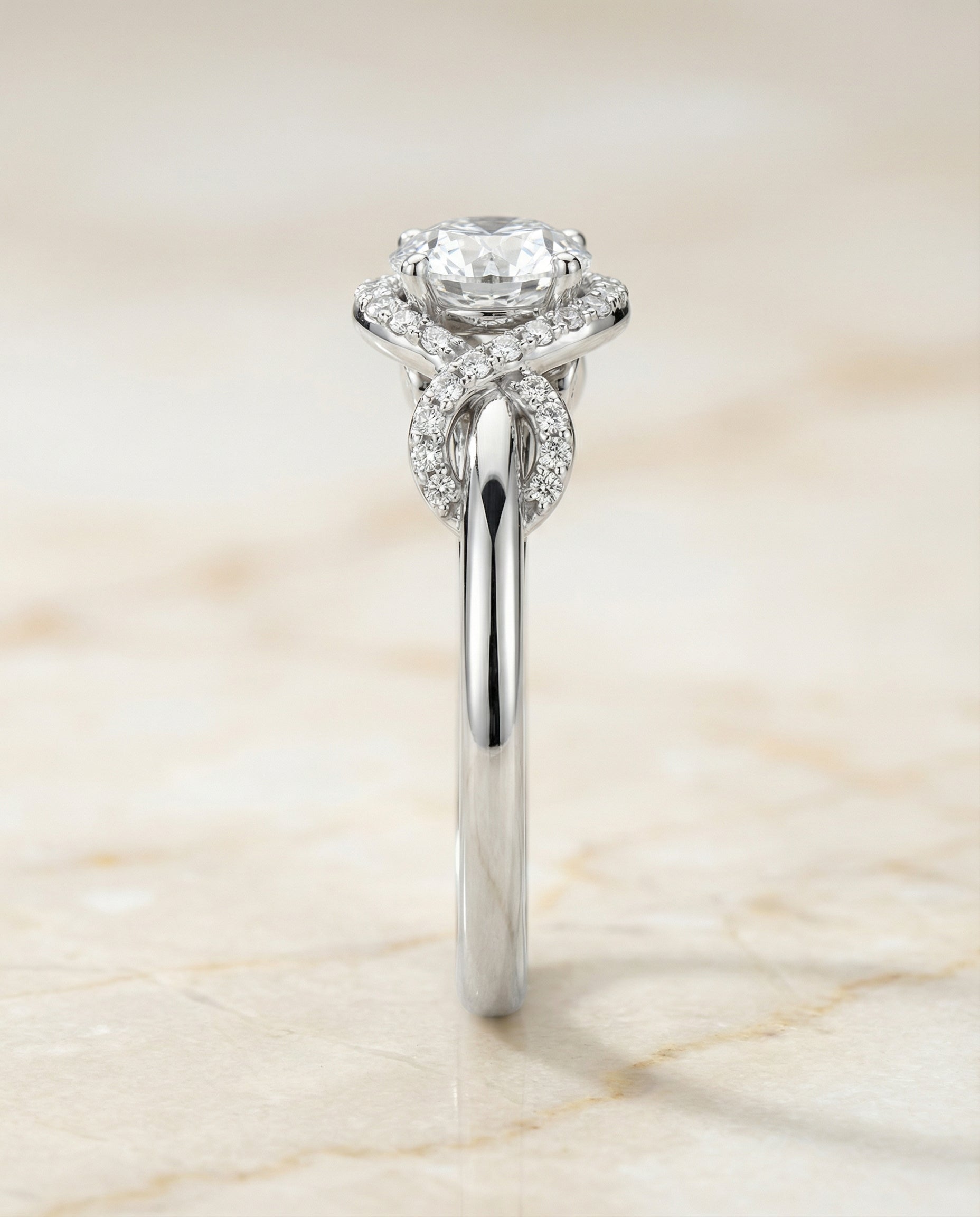 The Calista love knot halo engagement ring setting, shown in Platinum | RockHer