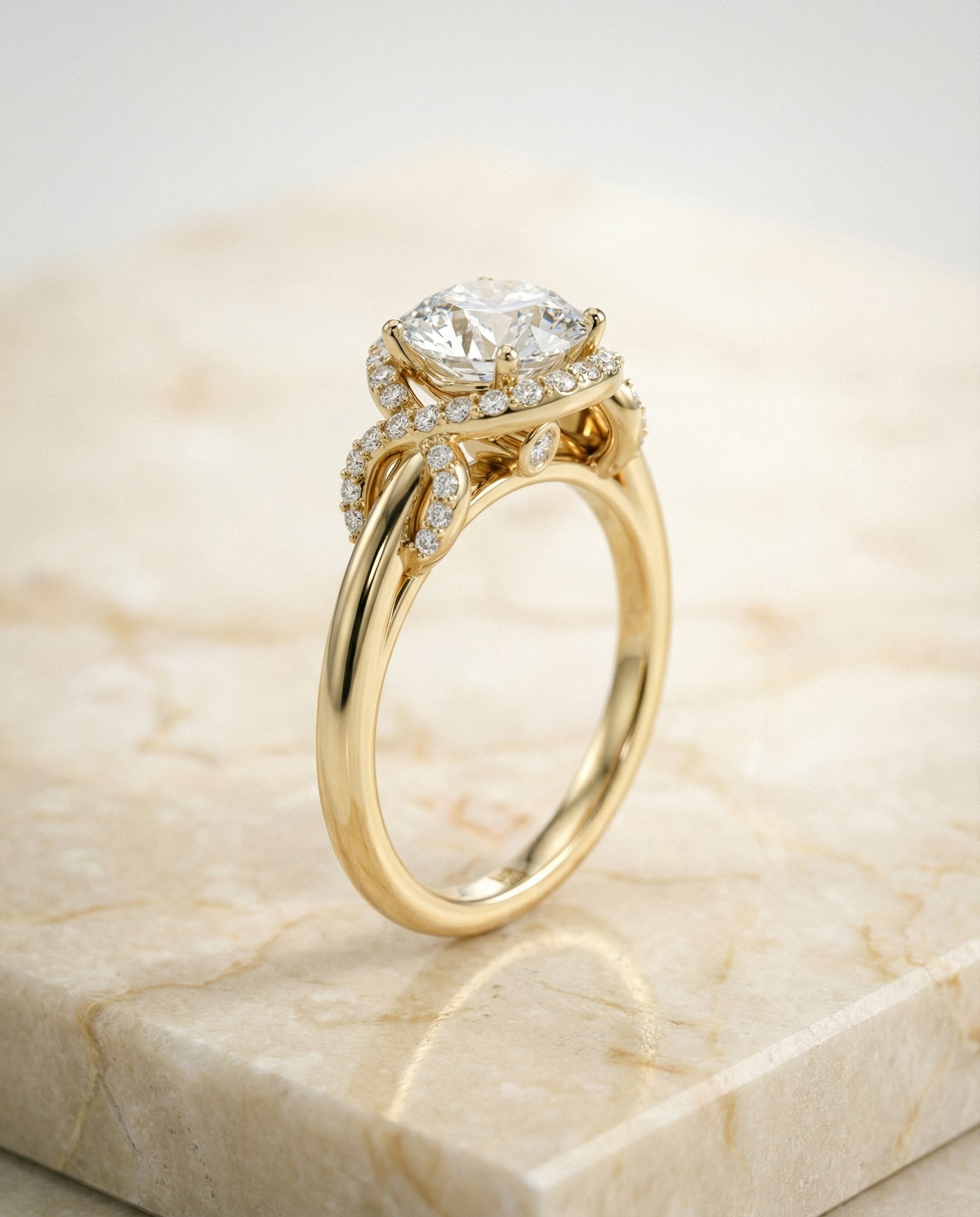The Calista love knot halo engagement ring setting, shown in 18K Yellow Gold | RockHer