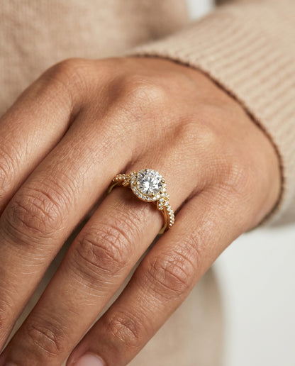 Round Brilliant, Love Knot Pavé Halo, in 18K Yellow Gold, pave setting – lifestyle shot | RockHer