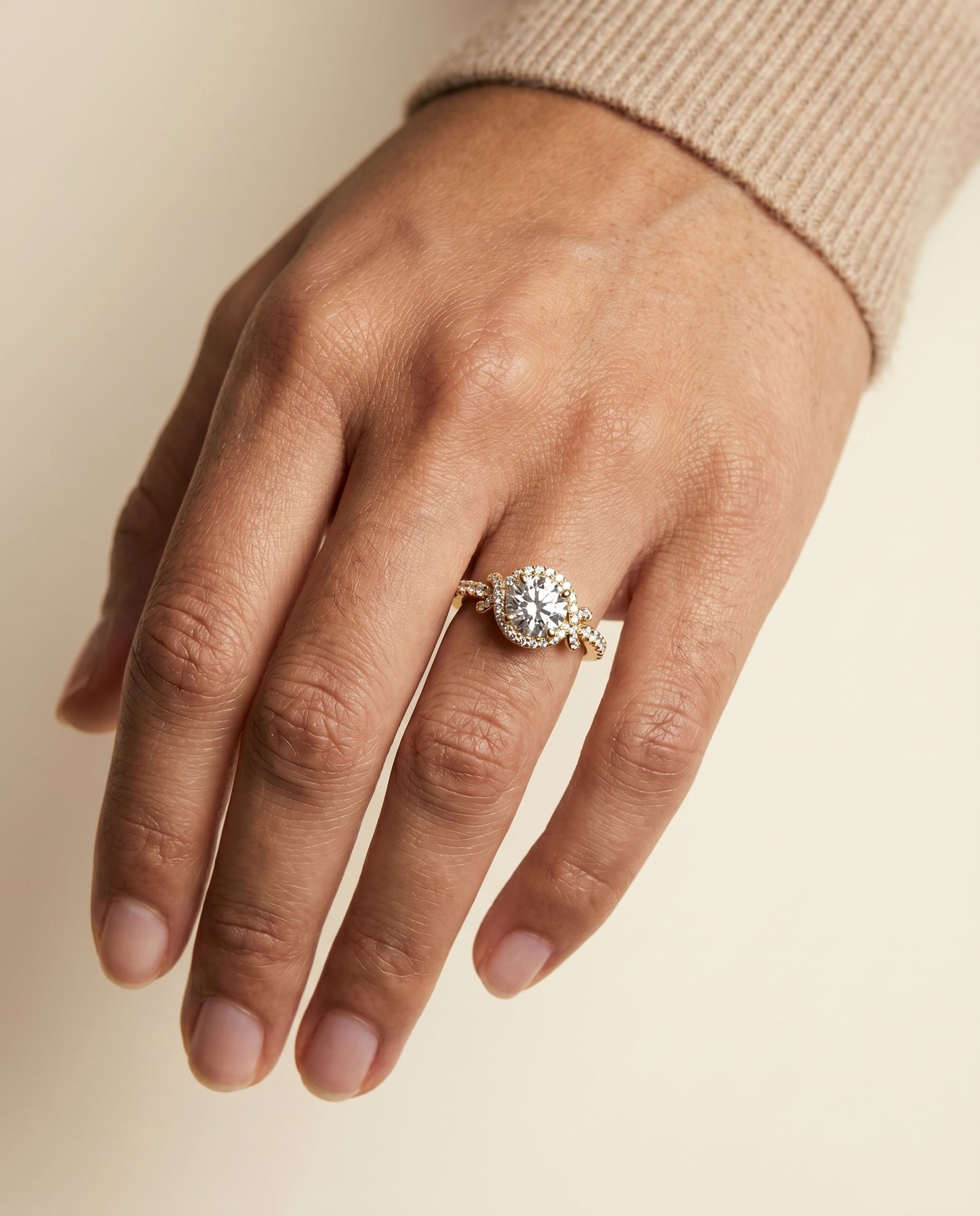 Round Brilliant, Love Knot Pavé Halo, in 18K Yellow Gold, pave setting – lifestyle shot | RockHer
