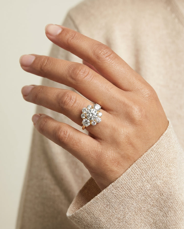 Pamina Select Cluster Halo Round Lab Diamond Engagement Ring in 18K Yellow Gold, shown on hand, angled | RockHer
