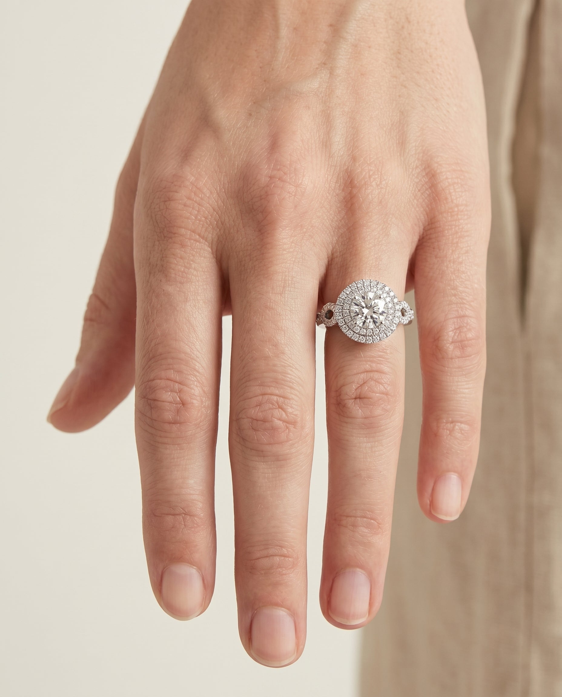 Calypso Select Double Halo Round Lab Diamond Engagement Ring in Platinum, shown on hand | RockHer