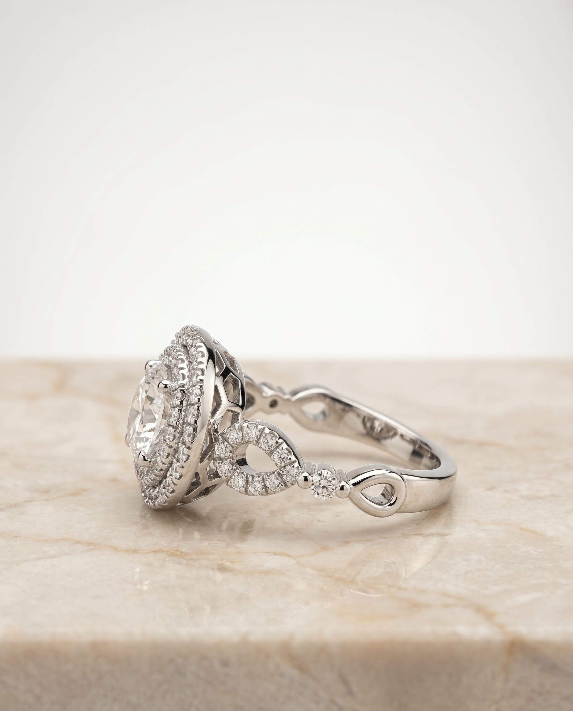 Calypso Select Double Halo Round Lab Diamond Engagement Ring in Platinum, side view | RockHer