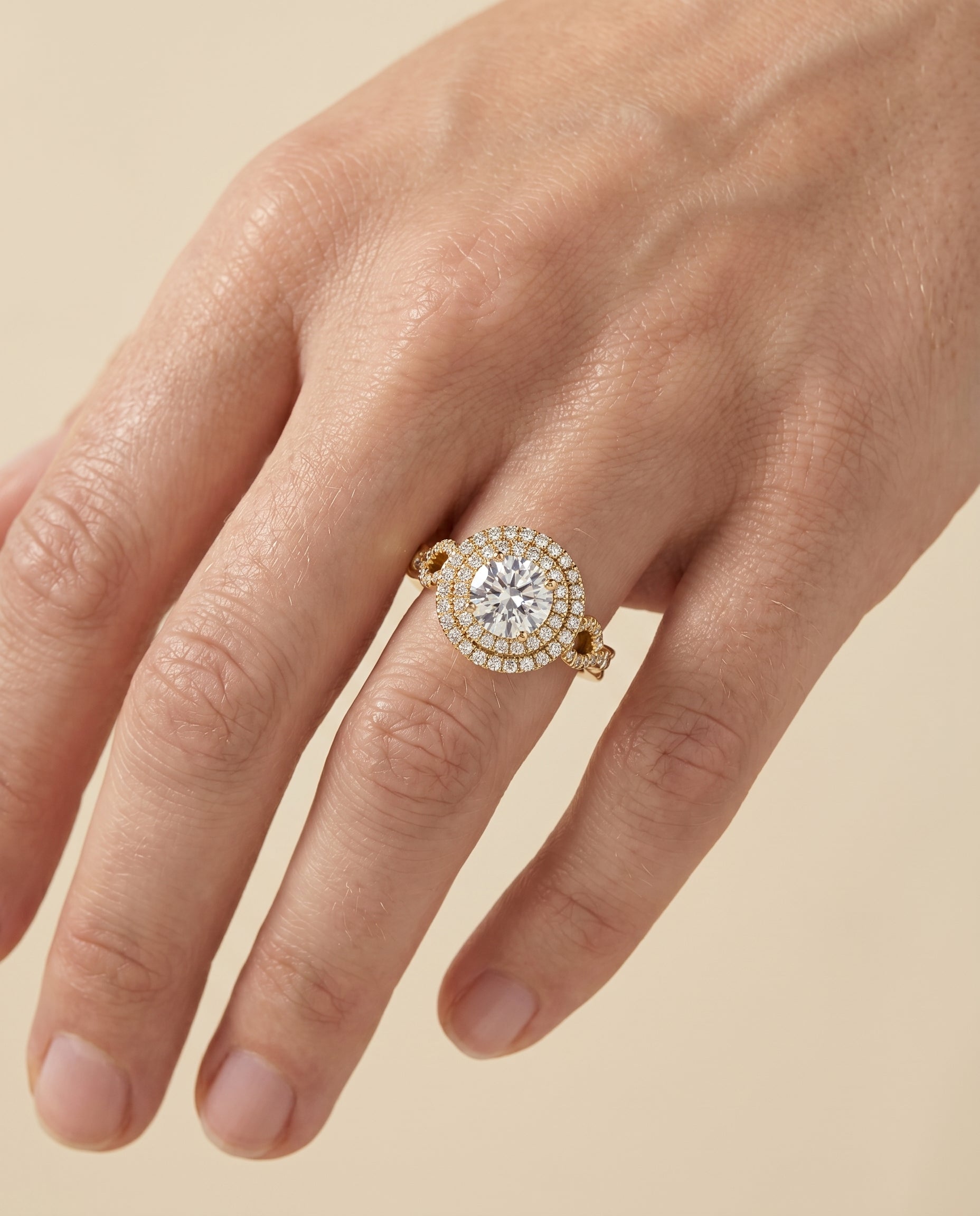 The Calypso setting for round diamonds, made to order in 18K Yellow Gold | RockHer