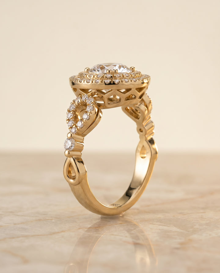 The Calypso Pavé Halo Engagement Ring Setting for Round Diamonds in 18K Yellow Gold