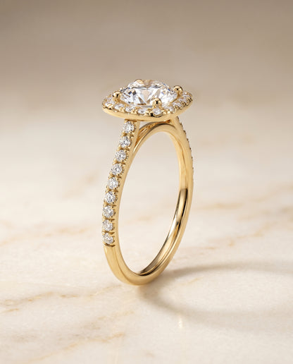 Round Brilliant, Pavé Halo, in 18K Yellow Gold, pave setting – angled view | RockHer