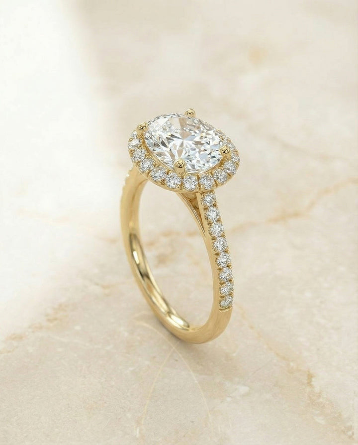 Dylan Select Petite French Pavé Halo Oval Engagement Ring, in 18K Yellow Gold, pave setting – angled view | RockHer