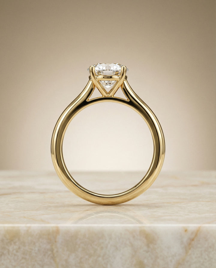 Round Brilliant, Pinched Cathedral Solitaire, in 18K Yellow Gold, prong setting – side profile | RockHer