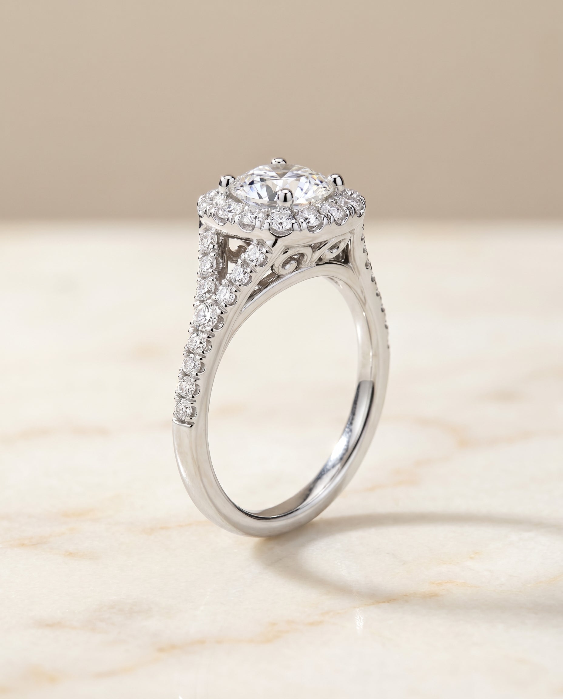 The Billie prong halo split shank cut engagement ring setting, shown in Platinum | RockHer