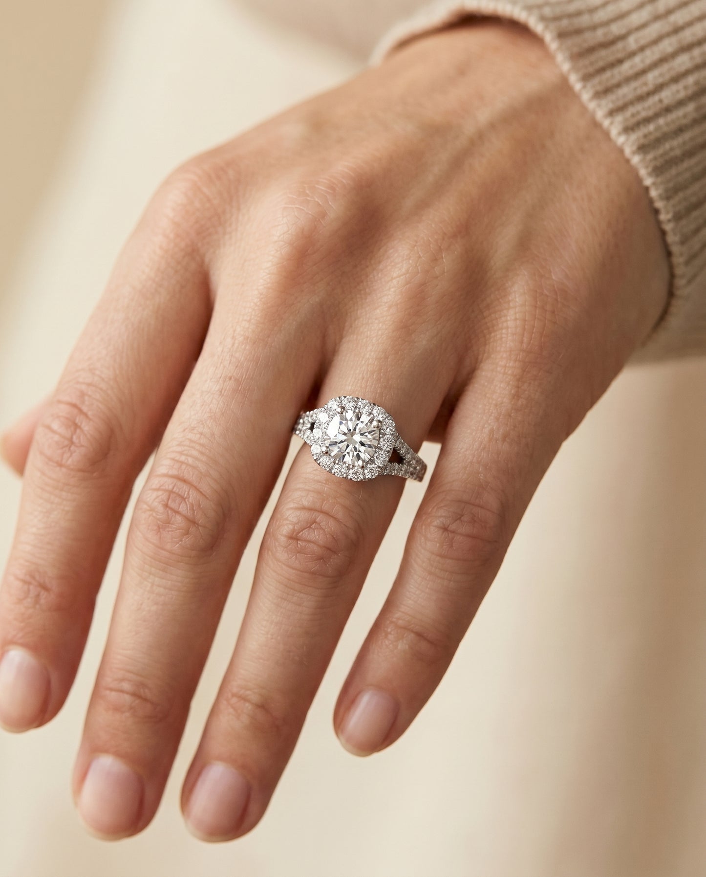 Prong Halo Split Shank Cushion, in Platinum, pave setting – lifestyle shot | RockHer