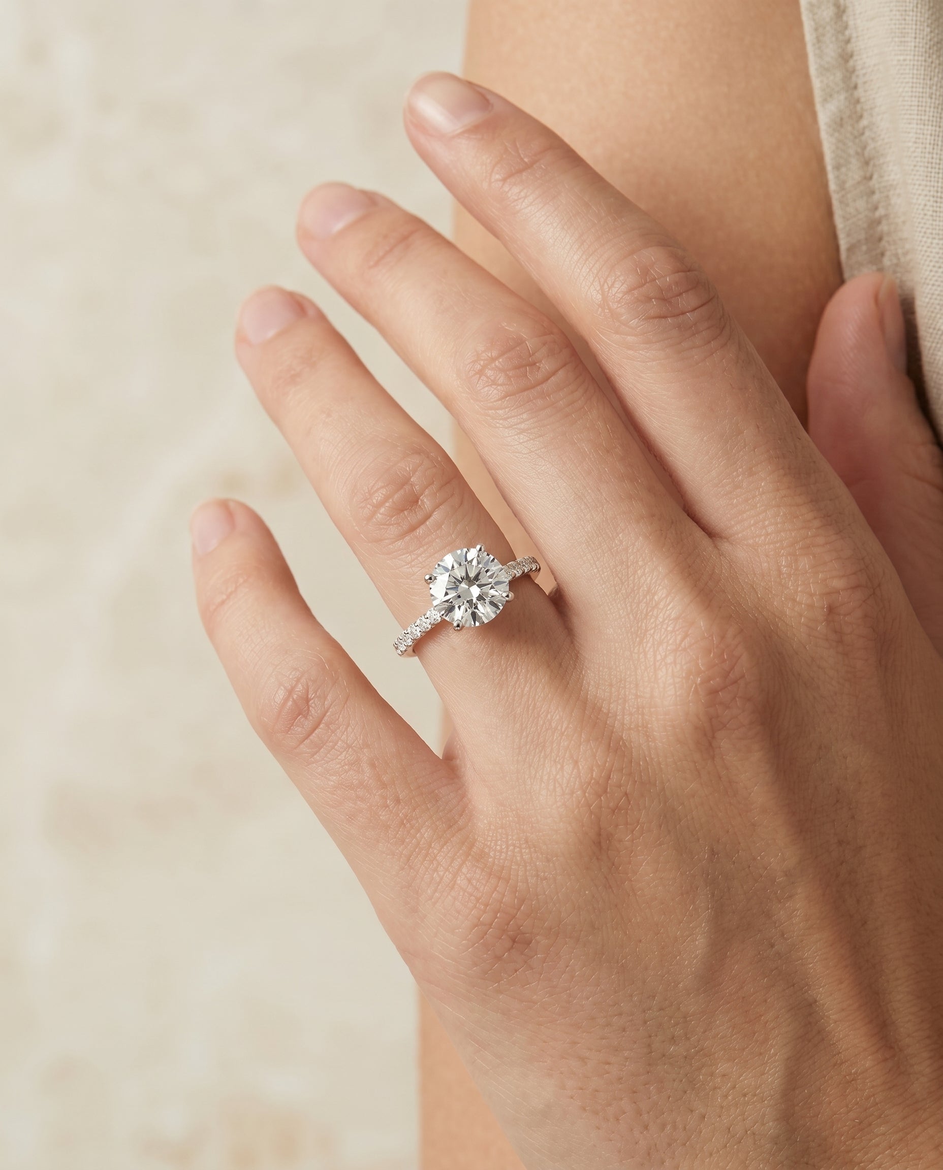 The Cherie engagement ring setting in Platinum, hidden halo pavé solitaire design | RockHer
