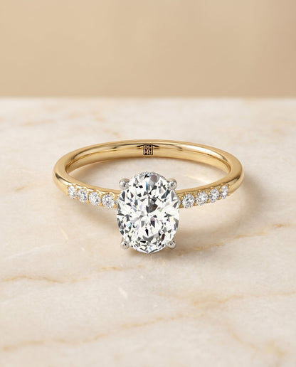 Cherie Select Hidden Halo Pavé Solitaire Oval Lab Diamond Engagement Ring in 18K Yellow Gold, alternate angle | RockHer
