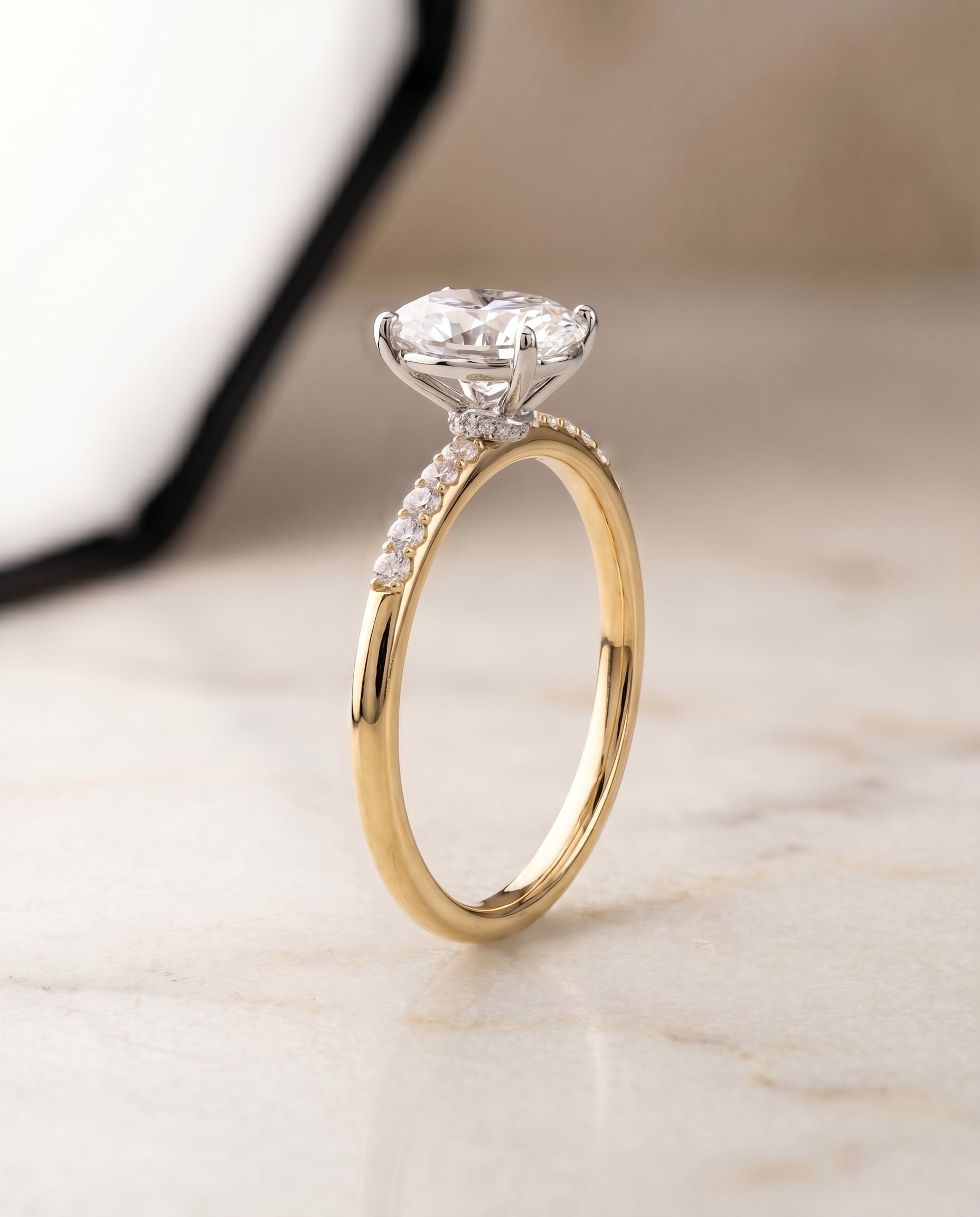 Hidden Halo Pavé Solitaire styling on The Cherie oval engagement ring setting | RockHer