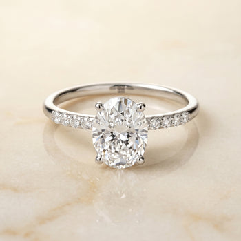 The Cherie Hidden Halo Pavé Solitaire Oval Engagement Ring Setting in Platinum