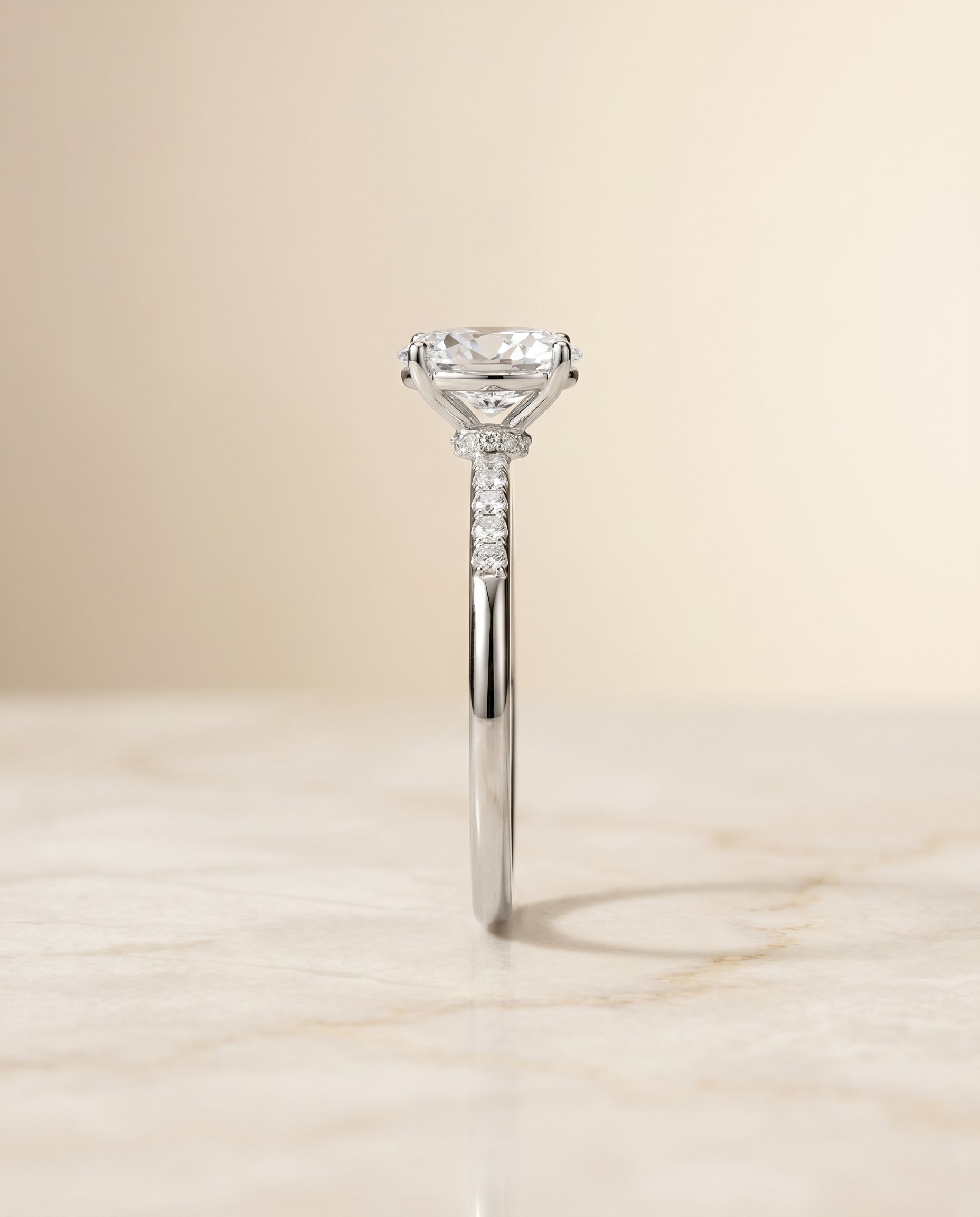 The Cherie hidden halo pavé solitaire engagement ring setting, shown in Platinum | RockHer
