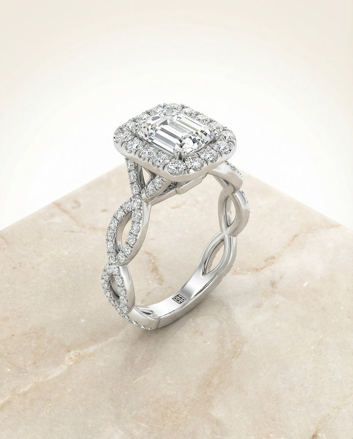 Ribbon Twist Pavé Halo Emerald in Platinum