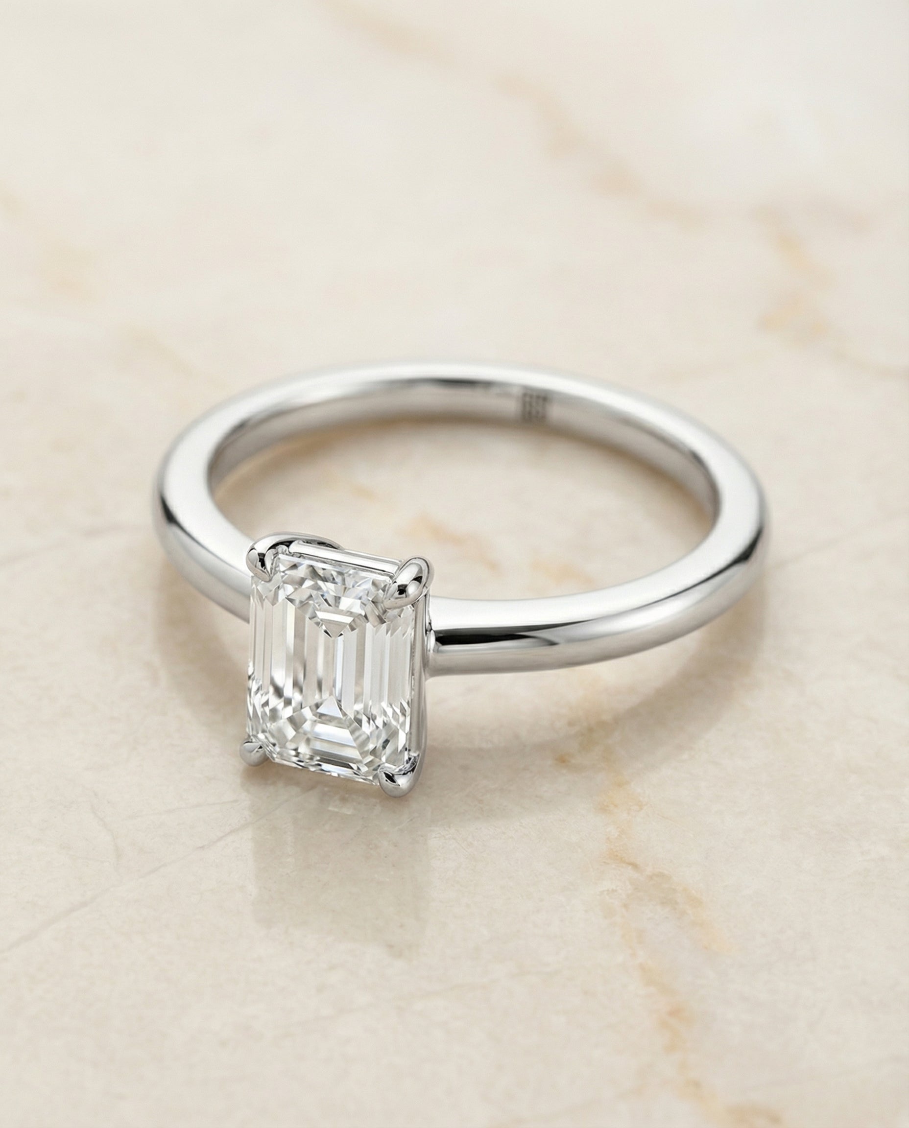 European Cut, Round Comfort Fit Claw Prong Solitaire Emerald, in Platinum – angled view | RockHer