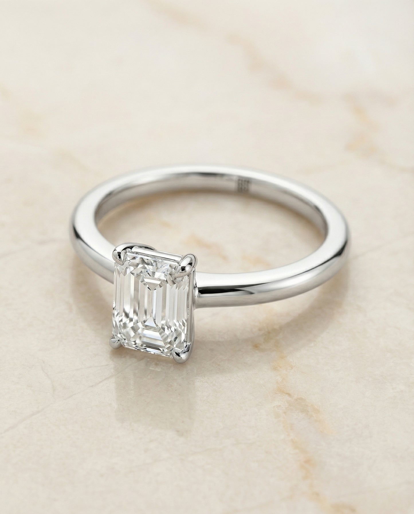European Cut, Round Comfort Fit Claw Prong Solitaire Emerald, in Platinum – angled view | RockHer