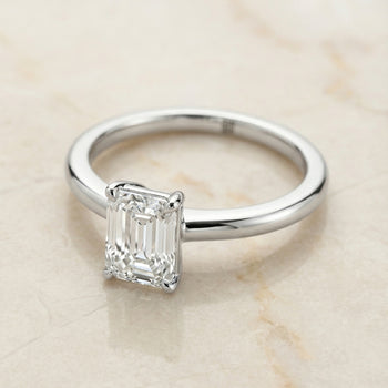 The Floria Comfort Fit Claw Prong Solitaire Emerald Cut Engagement Ring Setting in 18K White Gold