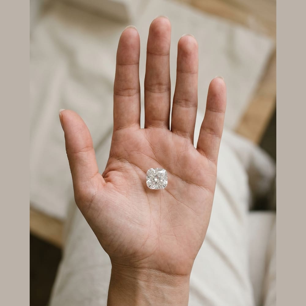 2-1/2 Carat Cushion Lab Grown Diamond, true-scale on open palm