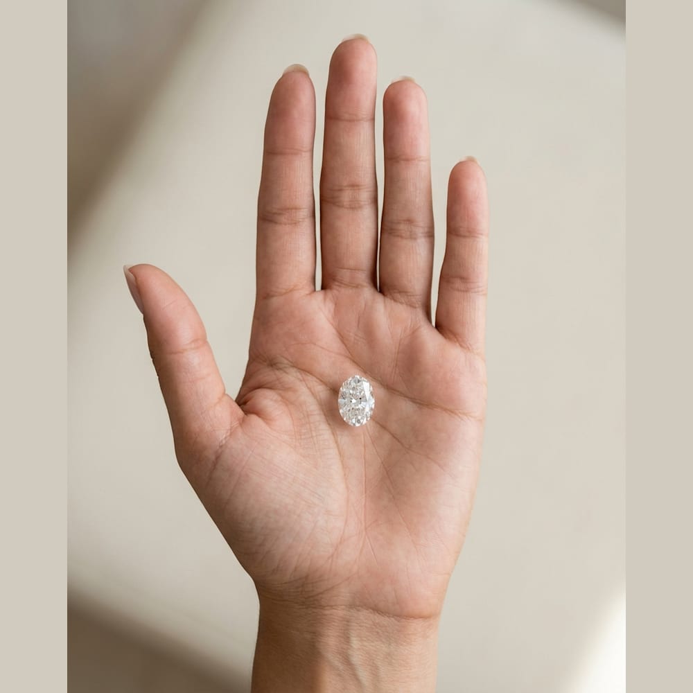 1-1/4 Carat Oval Lab Grown Diamond, true-scale on open palm