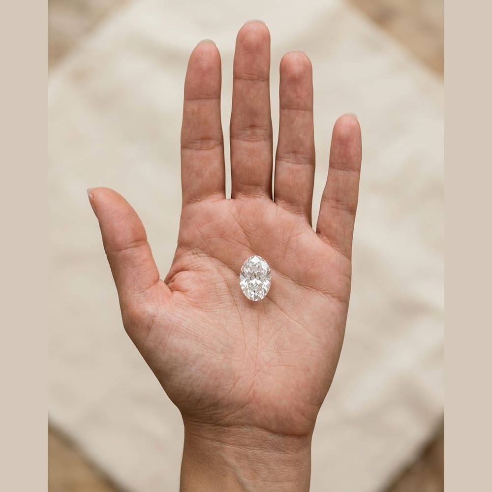 1-3/4 Carat Oval Lab Grown Diamond, true-scale on open palm