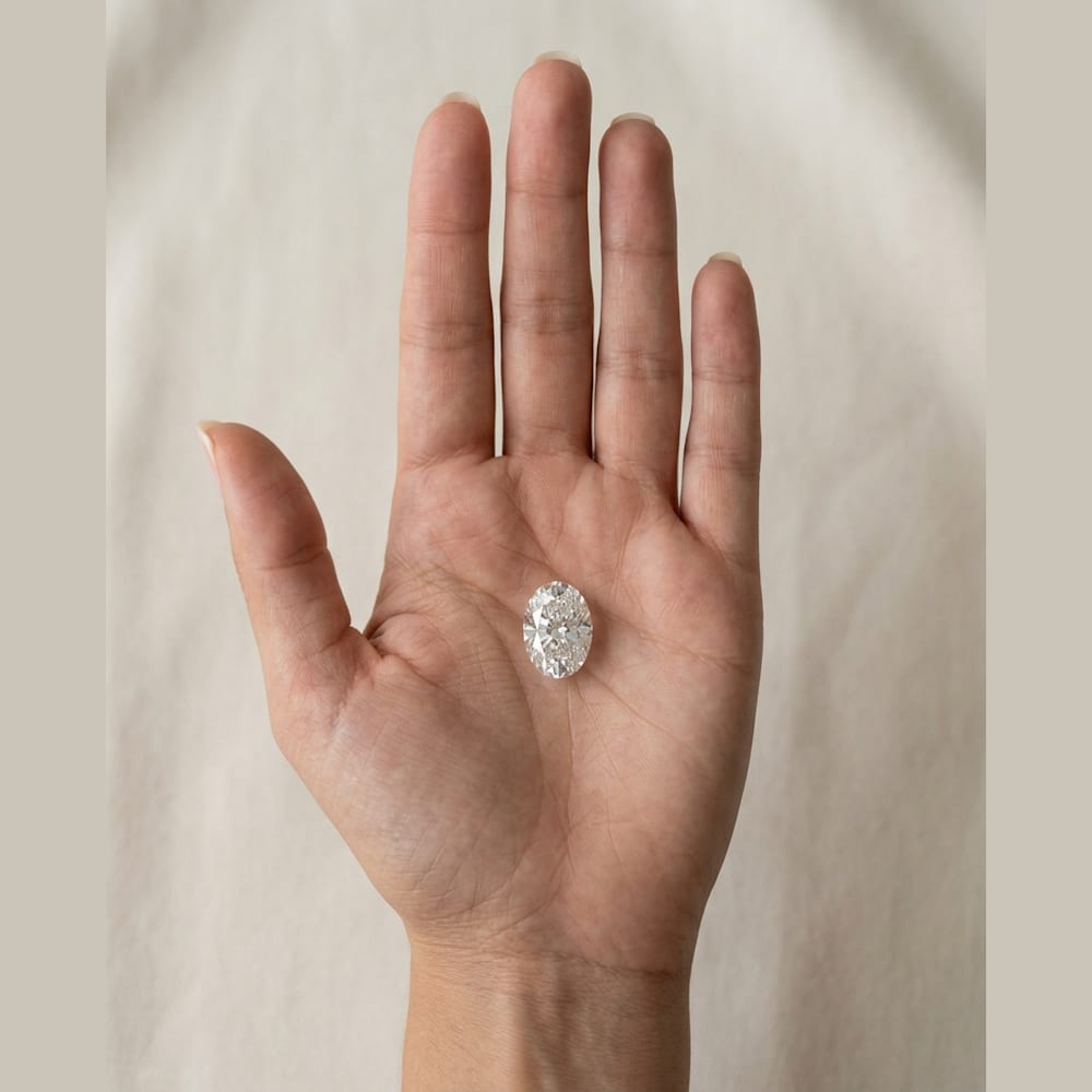 2-1/2 Carat Oval Lab Grown Diamond, true-scale on open palm