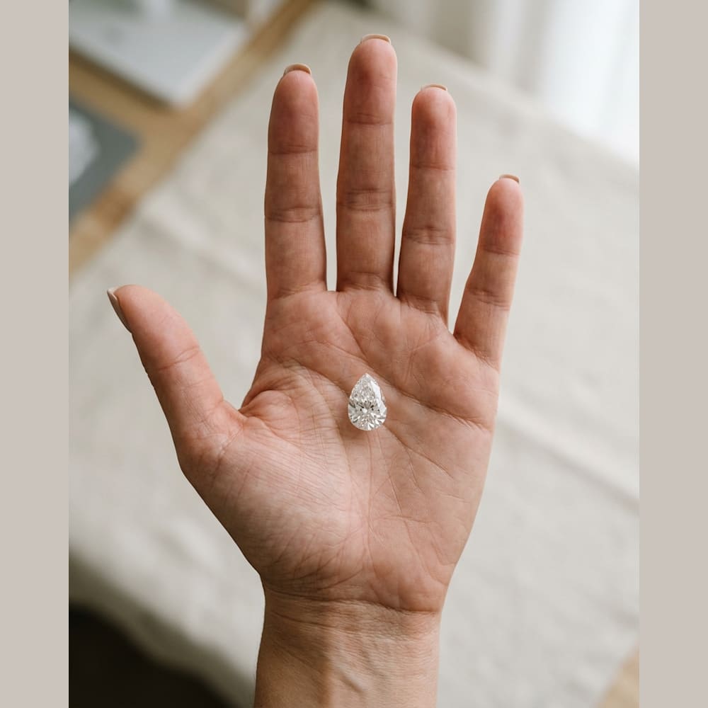 1-1/2 Carat Pear Lab Grown Diamond, true-scale on open palm