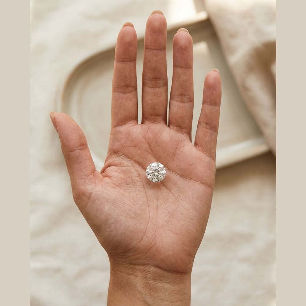 1-1/4 Carat Round Lab Grown Diamond, true-scale on open palm