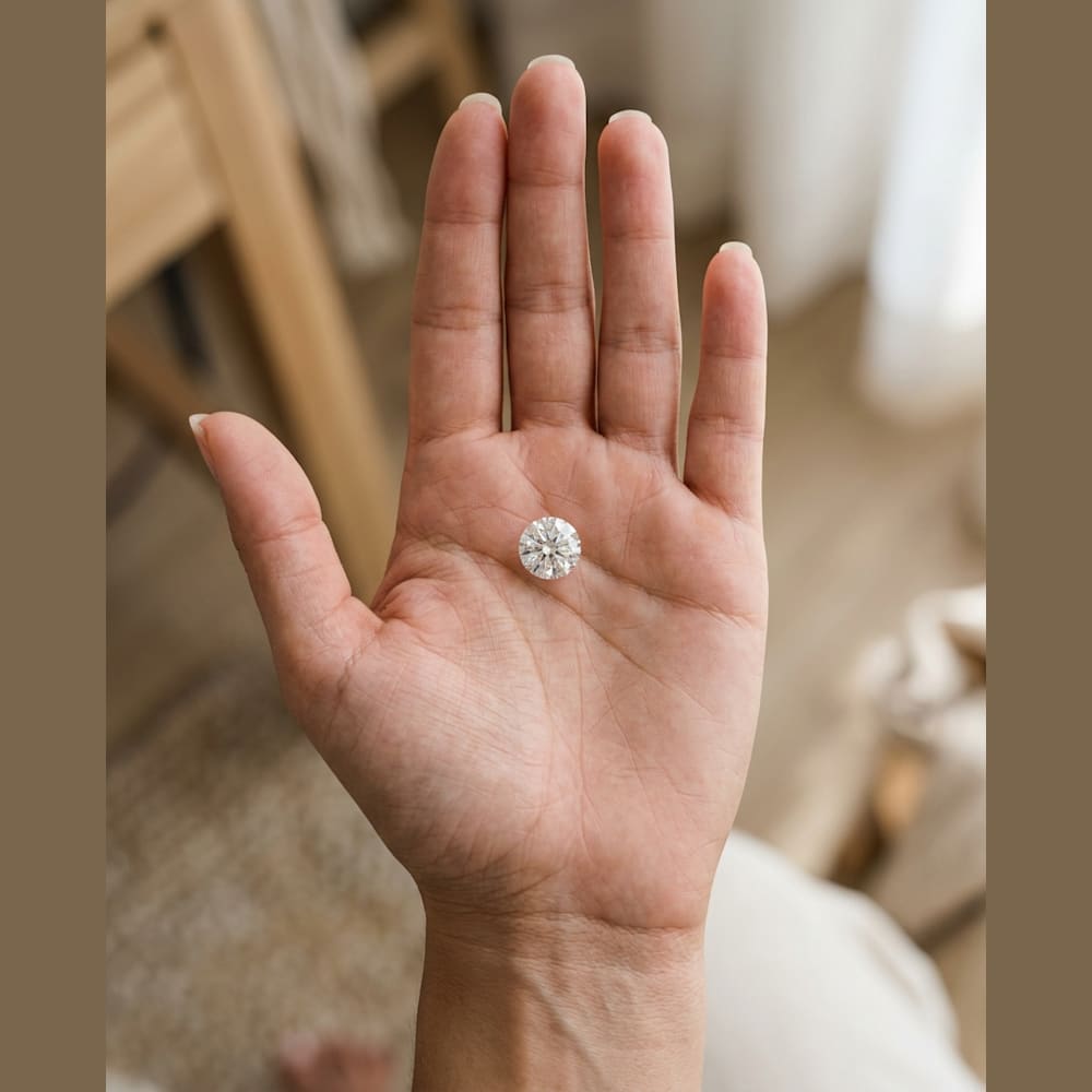 1-1/2 Carat Round Lab Grown Diamond, true-scale on open palm